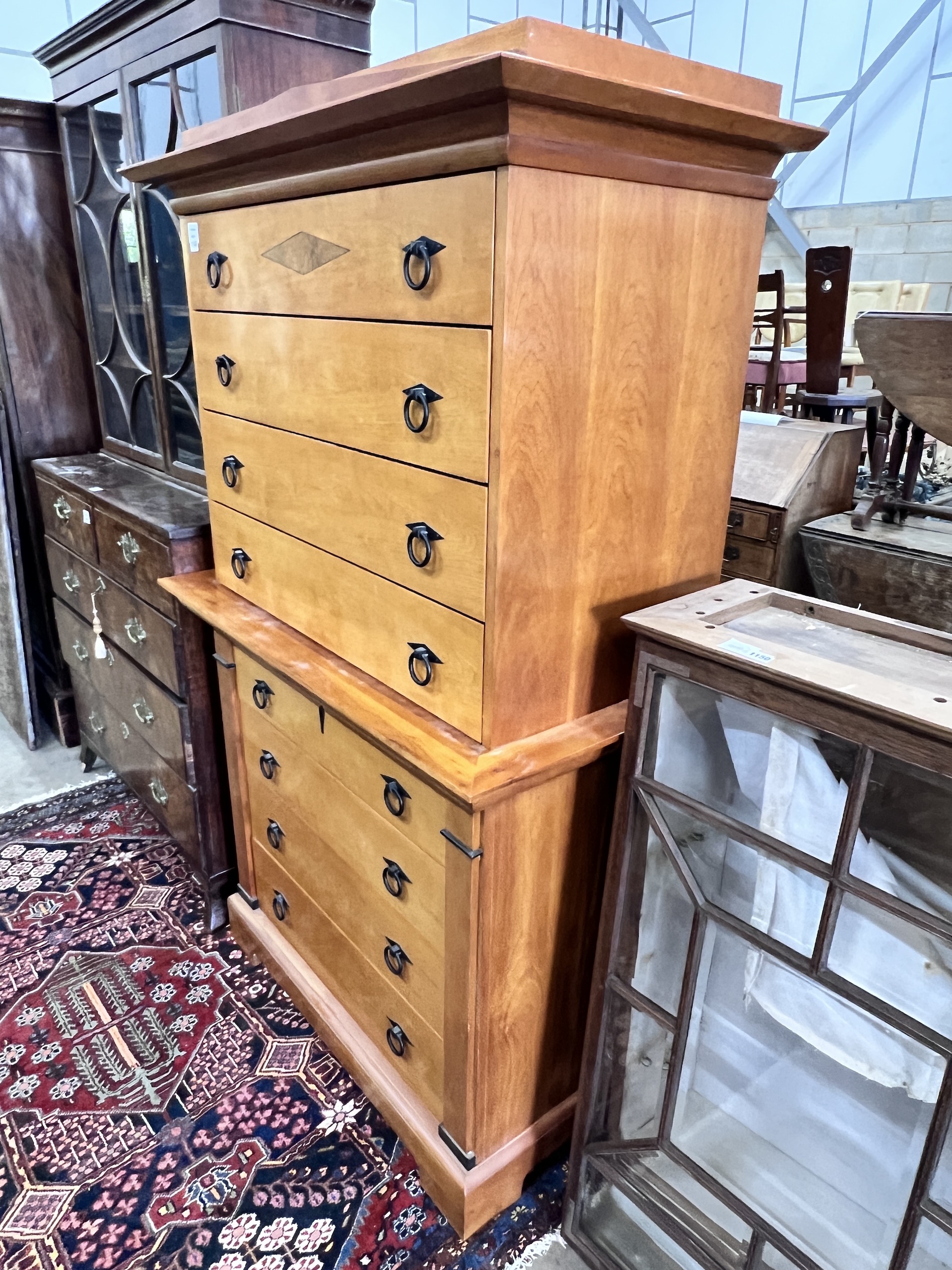 A Biedermeier style bois clair eight drawer chest on chest, width 104cm, depth 55cm, height 173cm